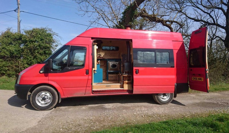 Former fire-and-rescue van transformed into unique campervan with wood burning stove, TV and oven
